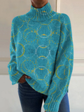 Elegant turtleneck sweater with artistic pattern in light colors